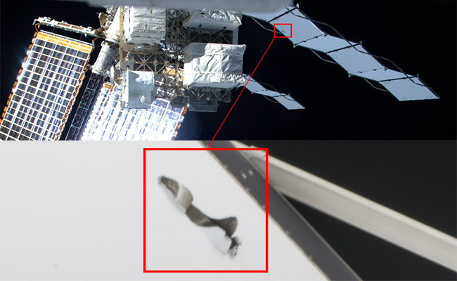 Picture of damage discovered on the 
							port side no. 4 radiator panel on the ISS.